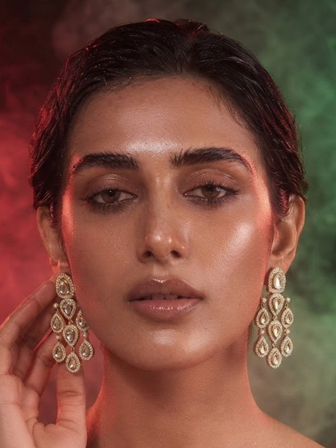 "Gold-plated American Diamond chandelier earrings with multi-tier teardrop CZ clusters, statement party wear earrings on white background"