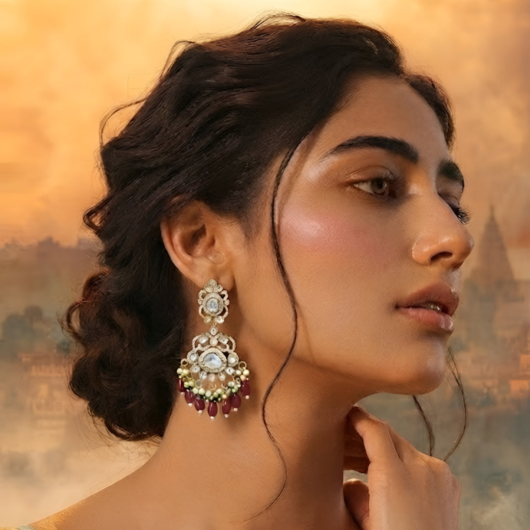 Antique gold Kundan Chandbali earrings with ruby bead drops, pearl clusters, and traditional bridal design for women.