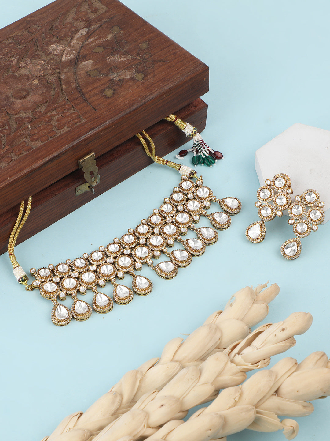 Gold-plated Kundan choker necklace set with teardrop stones and matching earrings for bridal and wedding wear
