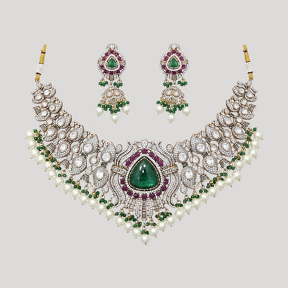 “Bridal Kundan choker necklace set with green center stone, ruby accents, pearls, and matching earrings”