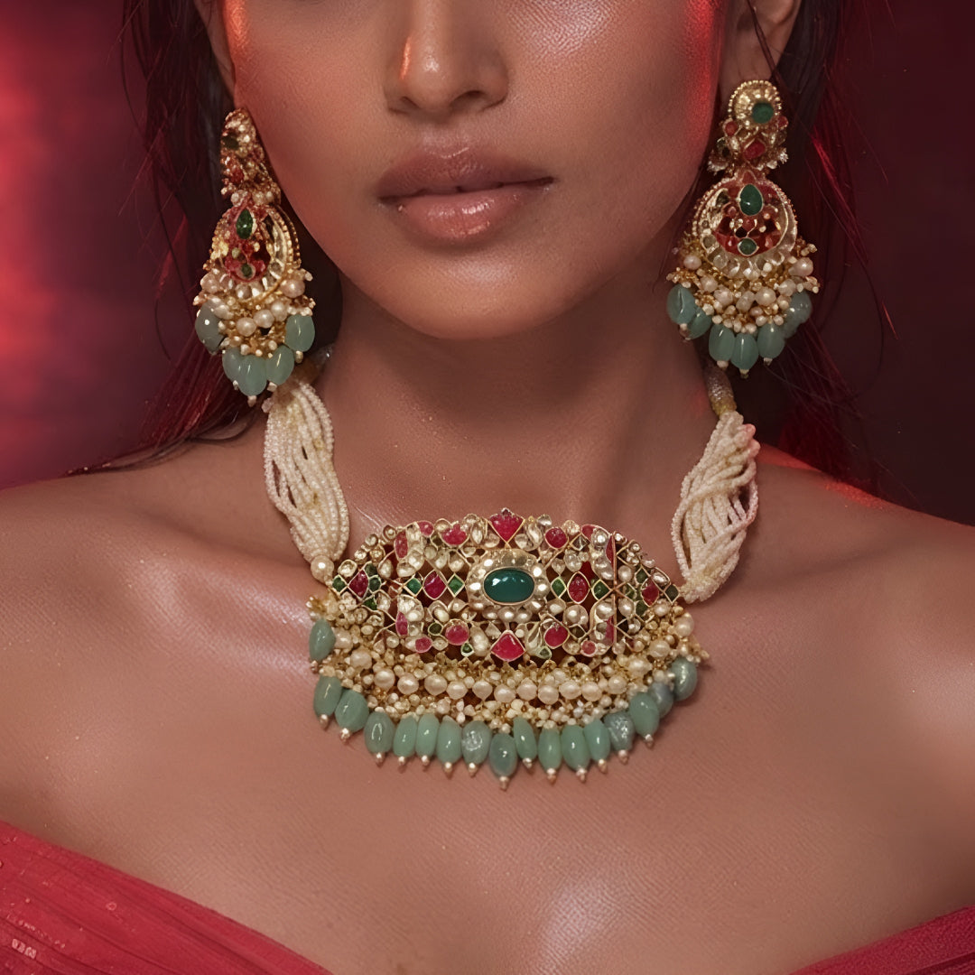 "Antique gold choker with ruby emerald stone work and matching earrings"