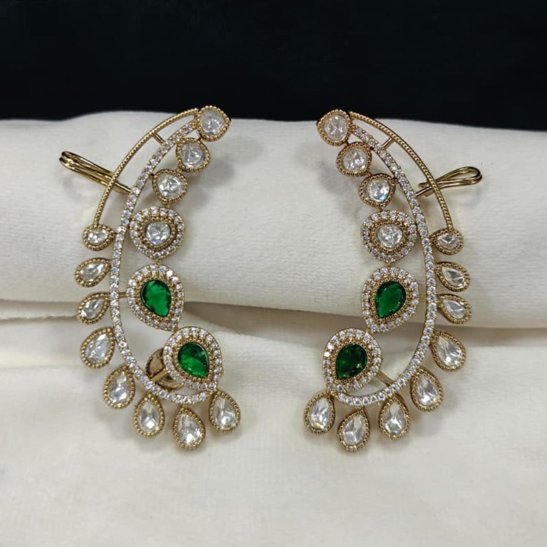 Luxury gold-plated ear cuff earrings with sparkling American diamonds and emerald green pear-shaped stones for women.