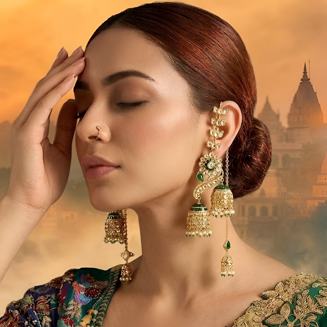 Gold-plated green Kundan peacock jhumka earrings with ear chain and double jhumka drops for bridal wear