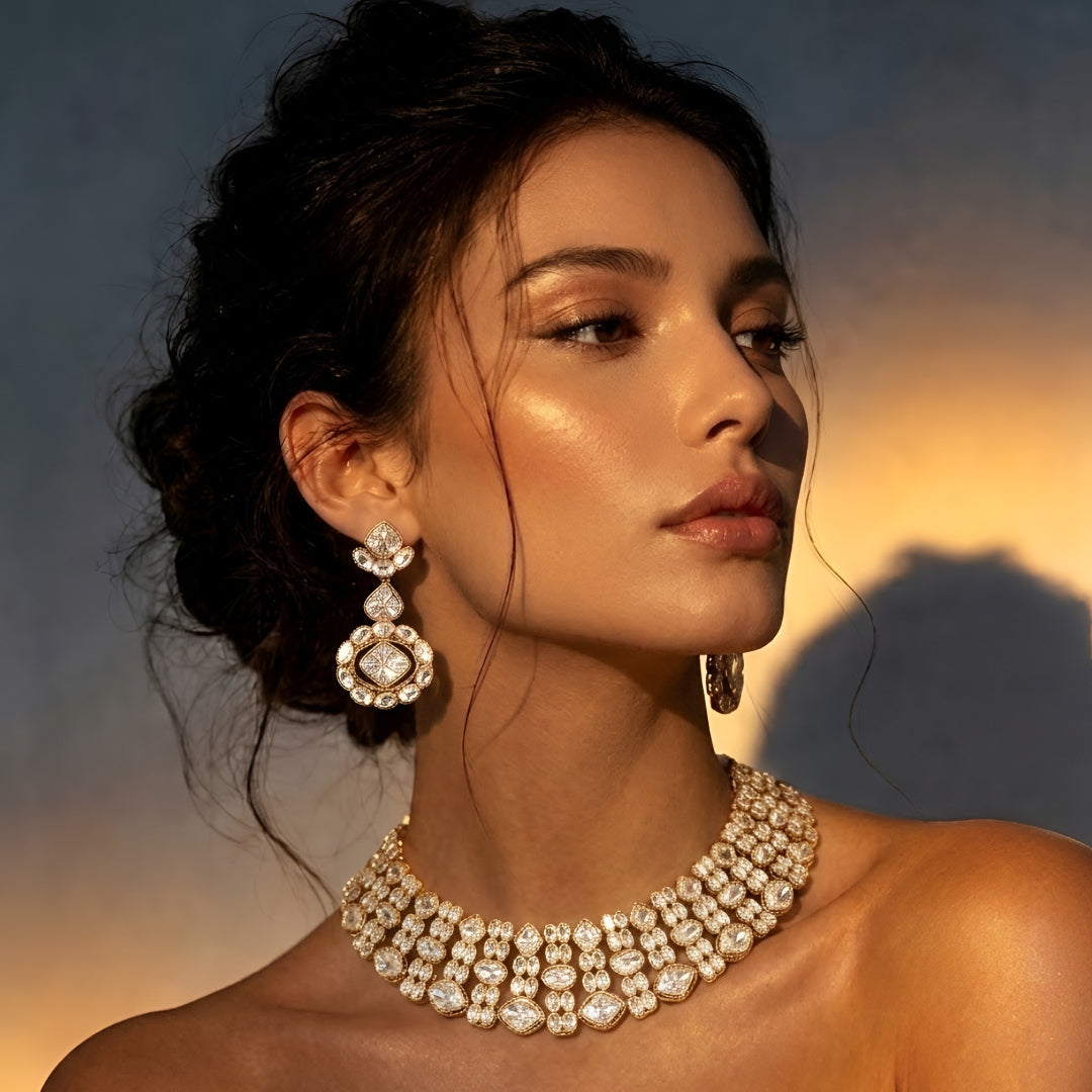 Gold-tone Kundan choker necklace set with matching earrings featuring white uncut-style stones, ideal for bridal, wedding, and festive wear.