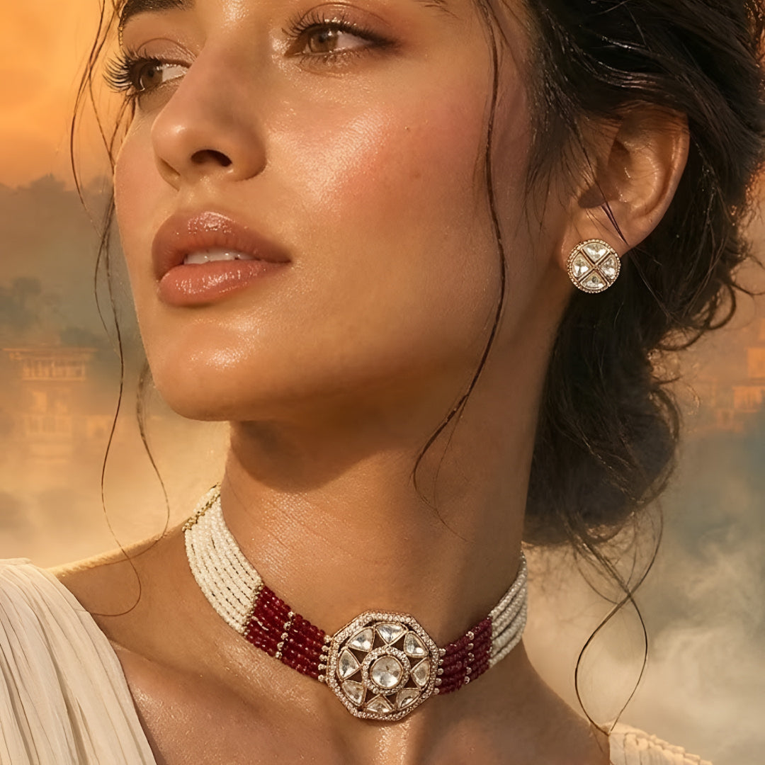 Handcrafted Kundan bracelet with red crystal bead strands and matching round stud earrings on a white background.