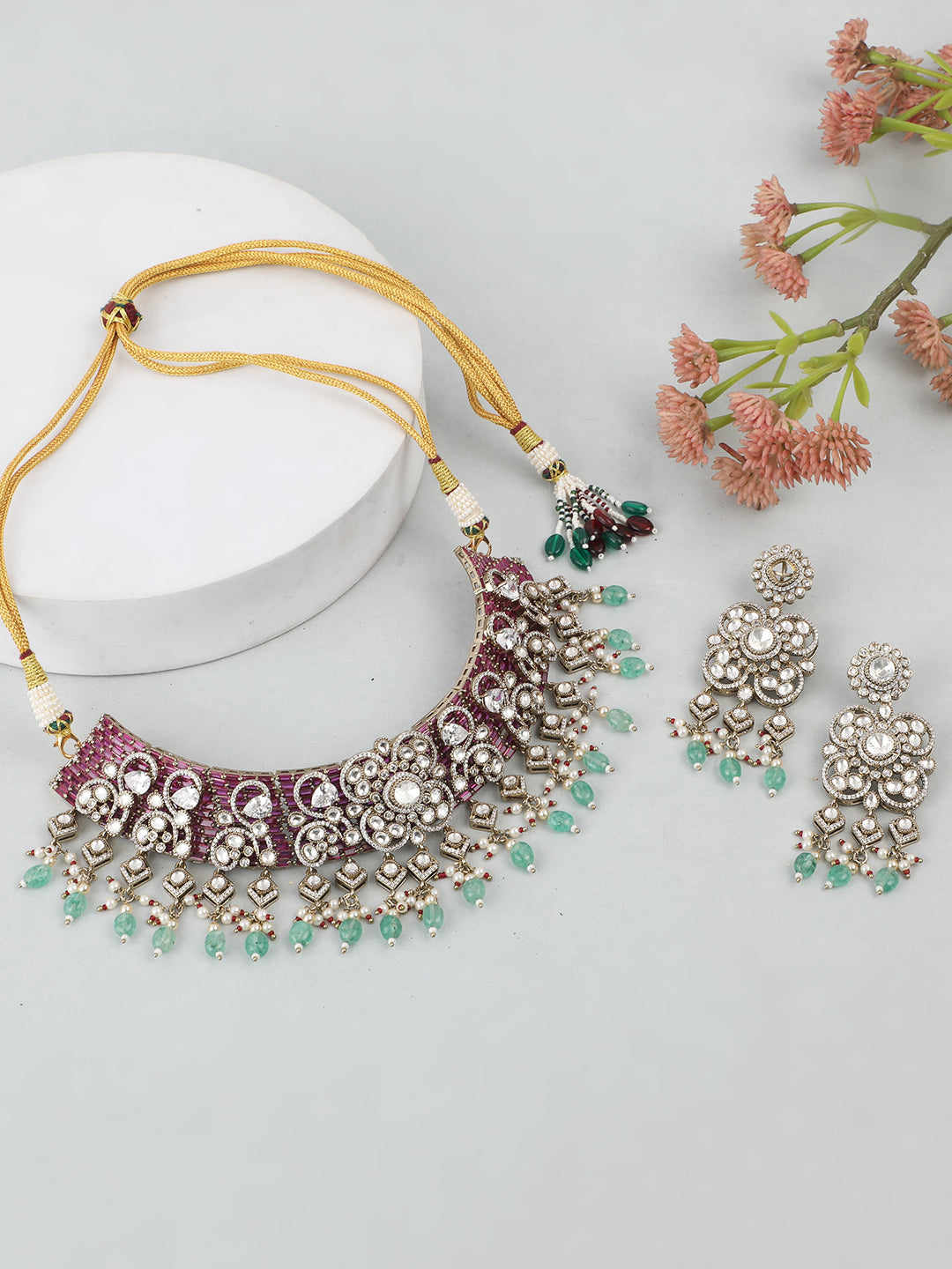 Kundan bridal necklace set with pink stones, green bead drops, and matching statement earrings in gold tone