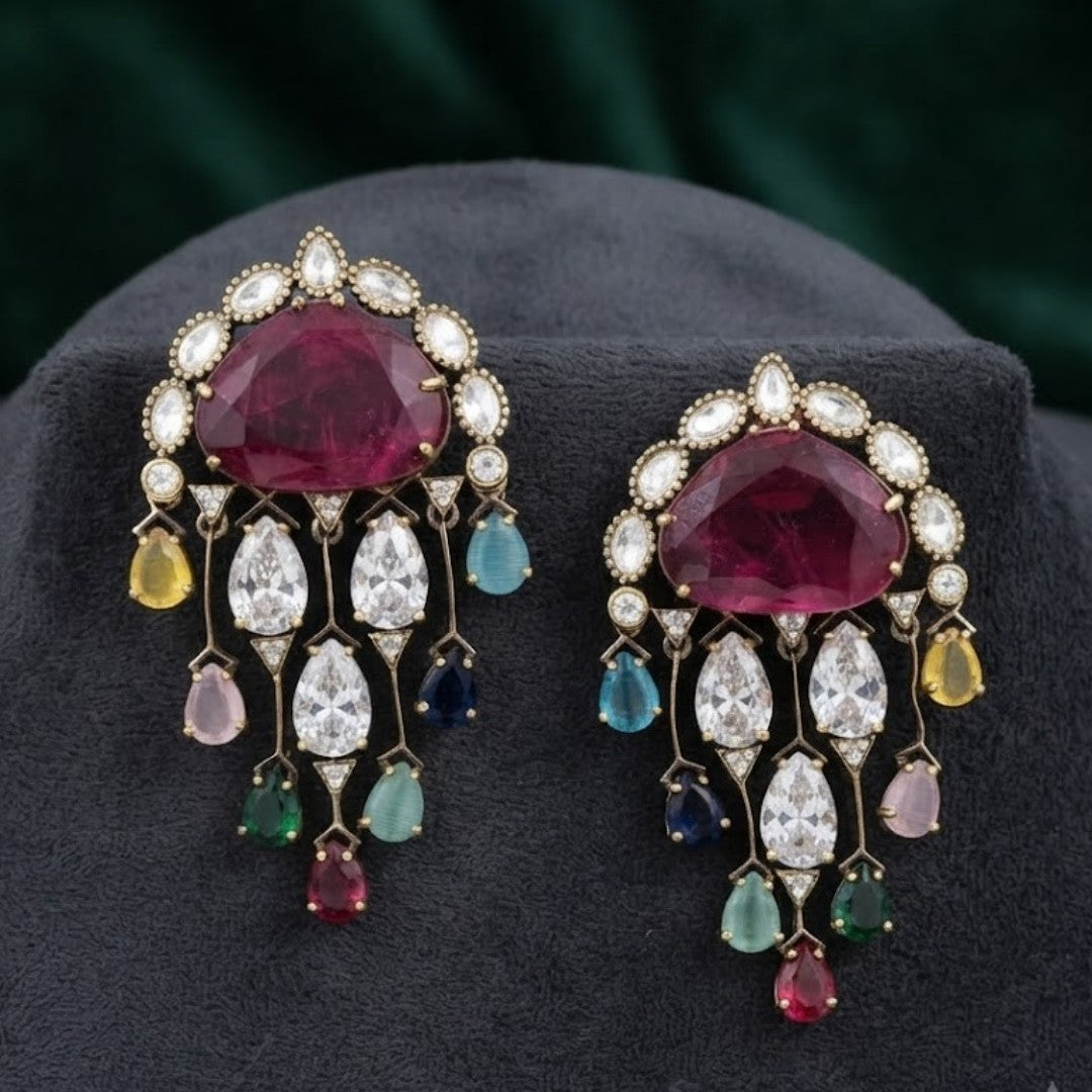 Luxury gold-plated multicolor crystal ear cuff earrings featuring a ruby pink center stone, sparkling cubic zirconia, and colorful gemstone-inspired drops for bridal and party wear.