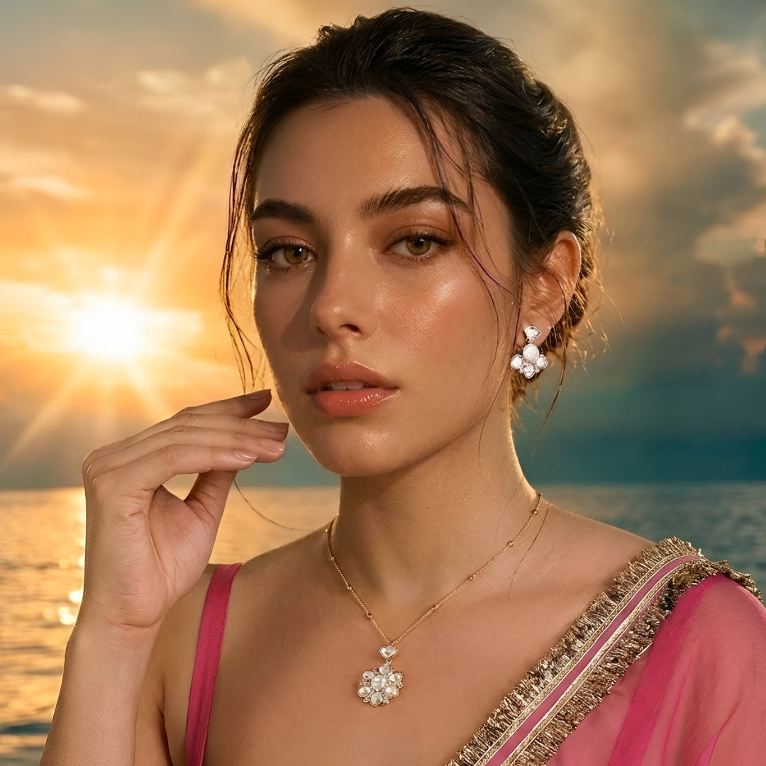 Gold-tone floral crystal pendant necklace with matching crystal earrings jewelry set featuring sparkling clear stones and elegant flower design.