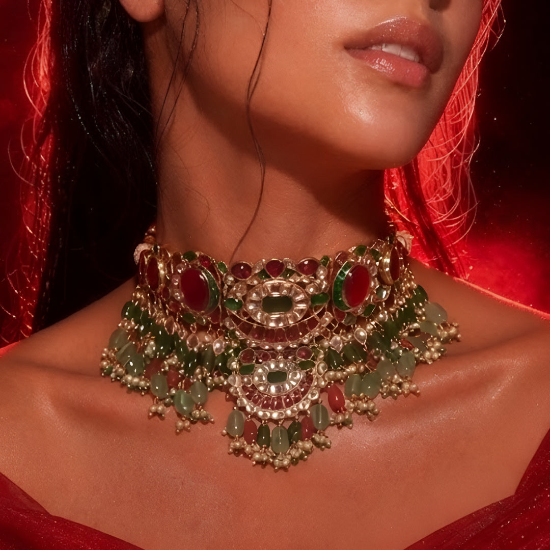 Kundan polki choker necklace with ruby and emerald stones on model