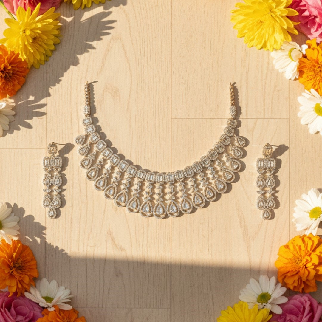 Gold plated bridal Kundan choker necklace set with teardrop earrings displayed on a red velvet stand.