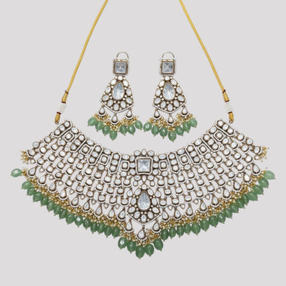 “Kundan choker necklace set with mirror stones and green bead drops, paired with matching earrings – bridal and ethnic jewellery for women.”
