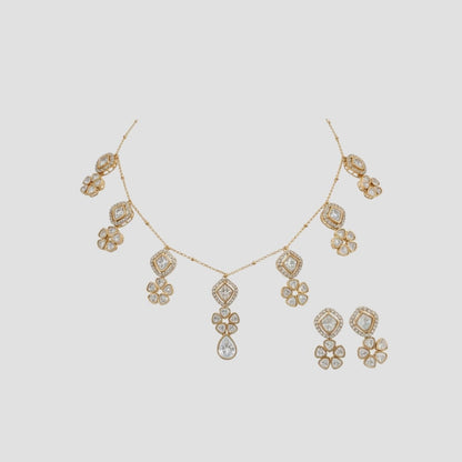 Gold-plated necklace set with floral and geometric crystal pendants and matching earrings
