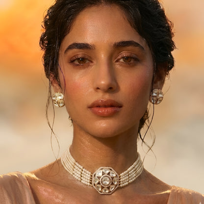 Traditional Kundan pearl choker necklace set with gold-tone finish, multi-strand pearls, and matching stud earrings for bridal and wedding wear.