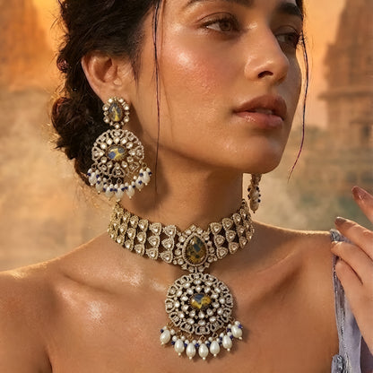 Royal blue stone Kundan choker necklace set with matching statement earrings featuring white Kundan stones, blue center stones, and pearl drop detailing.