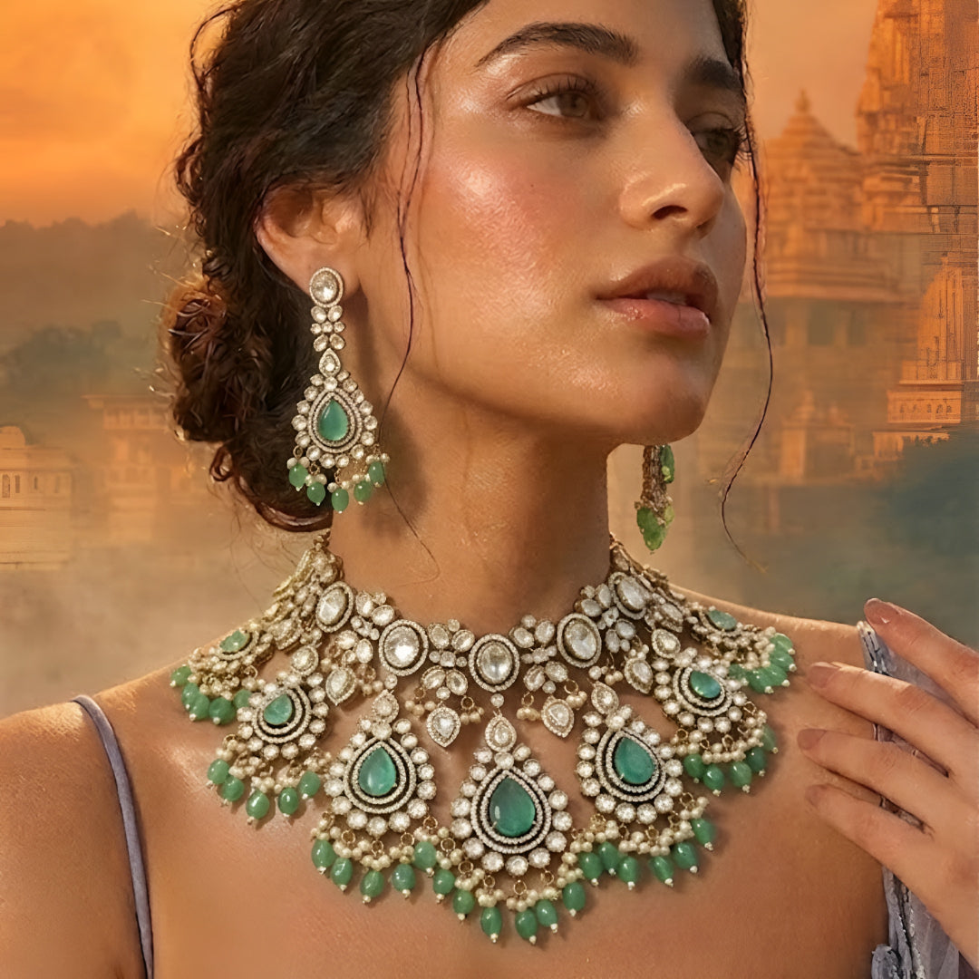 Luxury green Kundan bridal choker necklace set with matching earrings featuring white Kundan stones, green teardrop gemstones, and pearl bead detailing.