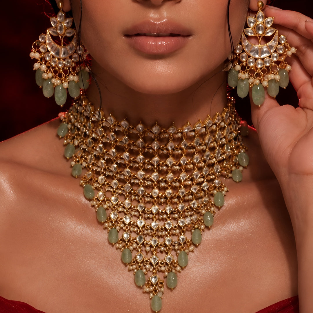 "Woman wearing gold Kundan choker necklace set with green beaded drops and matching chandbali earrings, bridal jewellery"