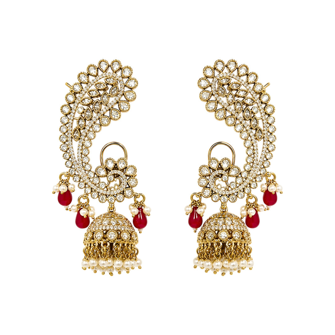 Luxury gold-plated Kundan Polki ear cuff jhumka earrings with ruby red bead drops, pearl tassels, and intricate floral detailing for bridal and festive wear.