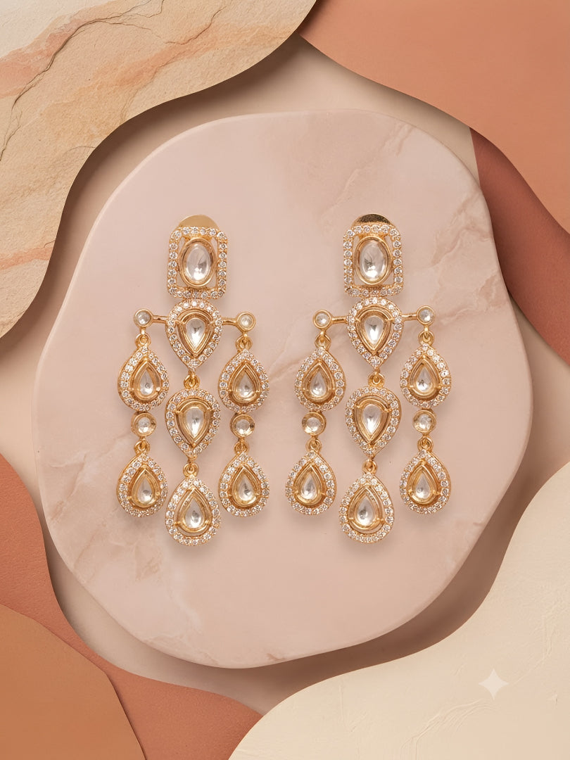 "Gold-plated American Diamond chandelier earrings with multi-tier teardrop CZ clusters, statement party wear earrings on white background"