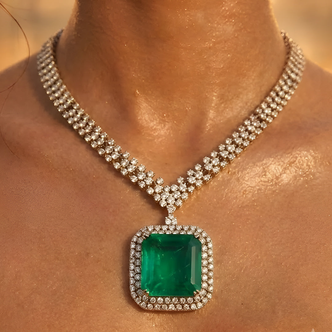 Elegant emerald green crystal pendant necklace set with sparkling zircon-studded chain and matching drop earrings in a gold-tone finish.