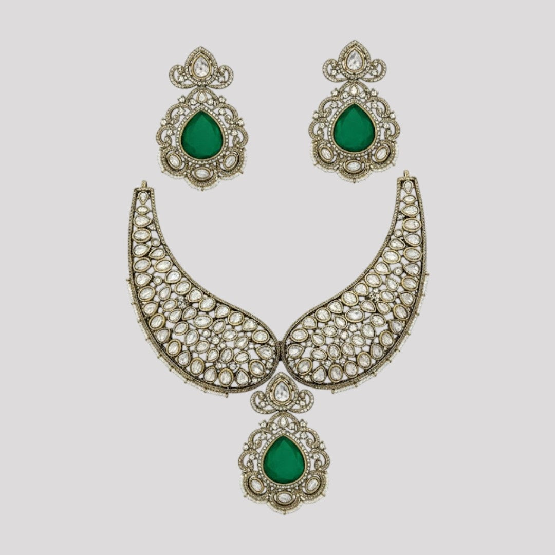 “Premium Polki Kundan necklace set with emerald green stones and matching earrings for bridal and wedding wear.”