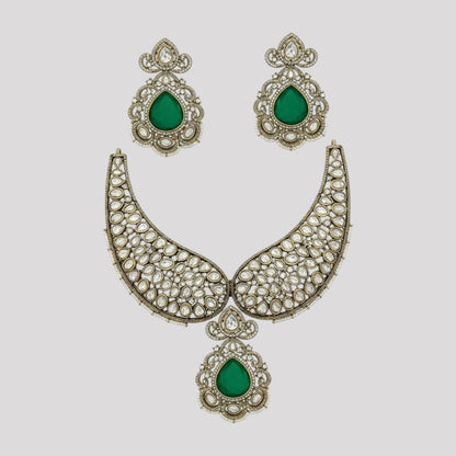 “Premium Polki Kundan necklace set with emerald green stones and matching earrings for bridal and wedding wear.”