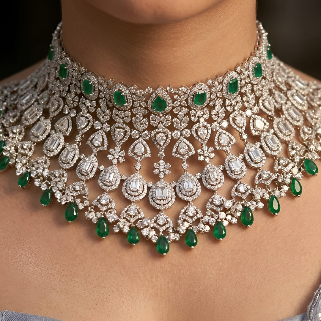 Green Kundan Polki bridal choker necklace set with intricate lattice design, pearl embellishments, green teardrop beads, and matching statement earrings.