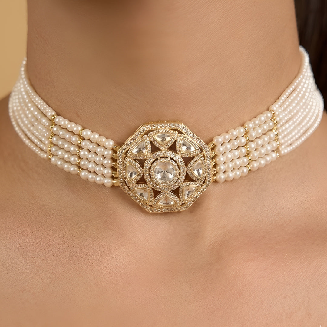 Elegant pearl kundan choker necklace set with matching stud earrings featuring gold-tone finish and traditional ethnic design for women.