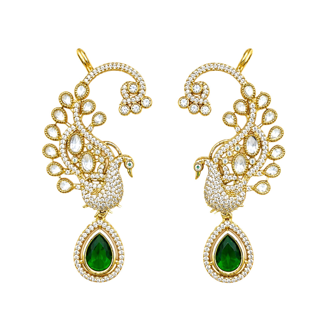 Luxury gold-plated peacock ear cuff earrings with Kundan Polki stones, sparkling CZ detailing, and emerald green teardrop crystal pendant for bridal and festive wear.