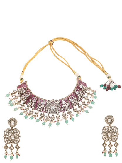 Kundan bridal necklace set with pink stones, green bead drops, and matching statement earrings in gold tone