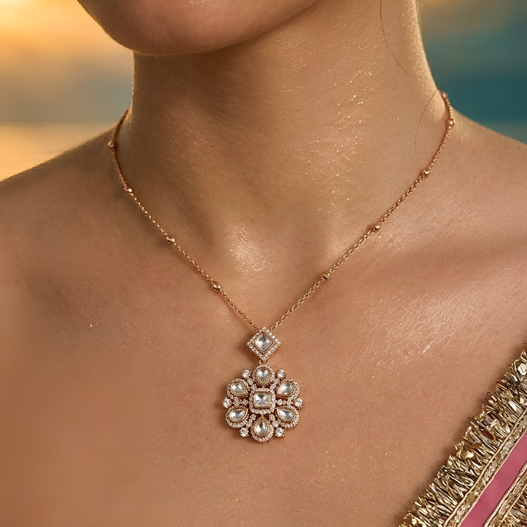 Gold-tone floral crystal pendant necklace with matching crystal earrings jewelry set featuring sparkling clear stones and elegant flower design.