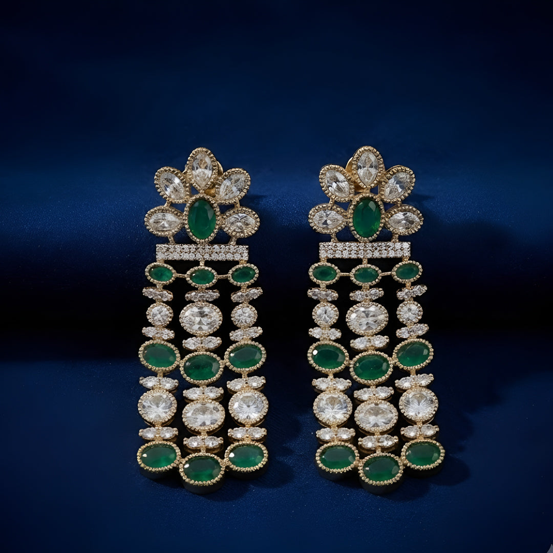 Luxury gold-plated chandelier earrings featuring emerald green oval stones and sparkling American diamonds for women.