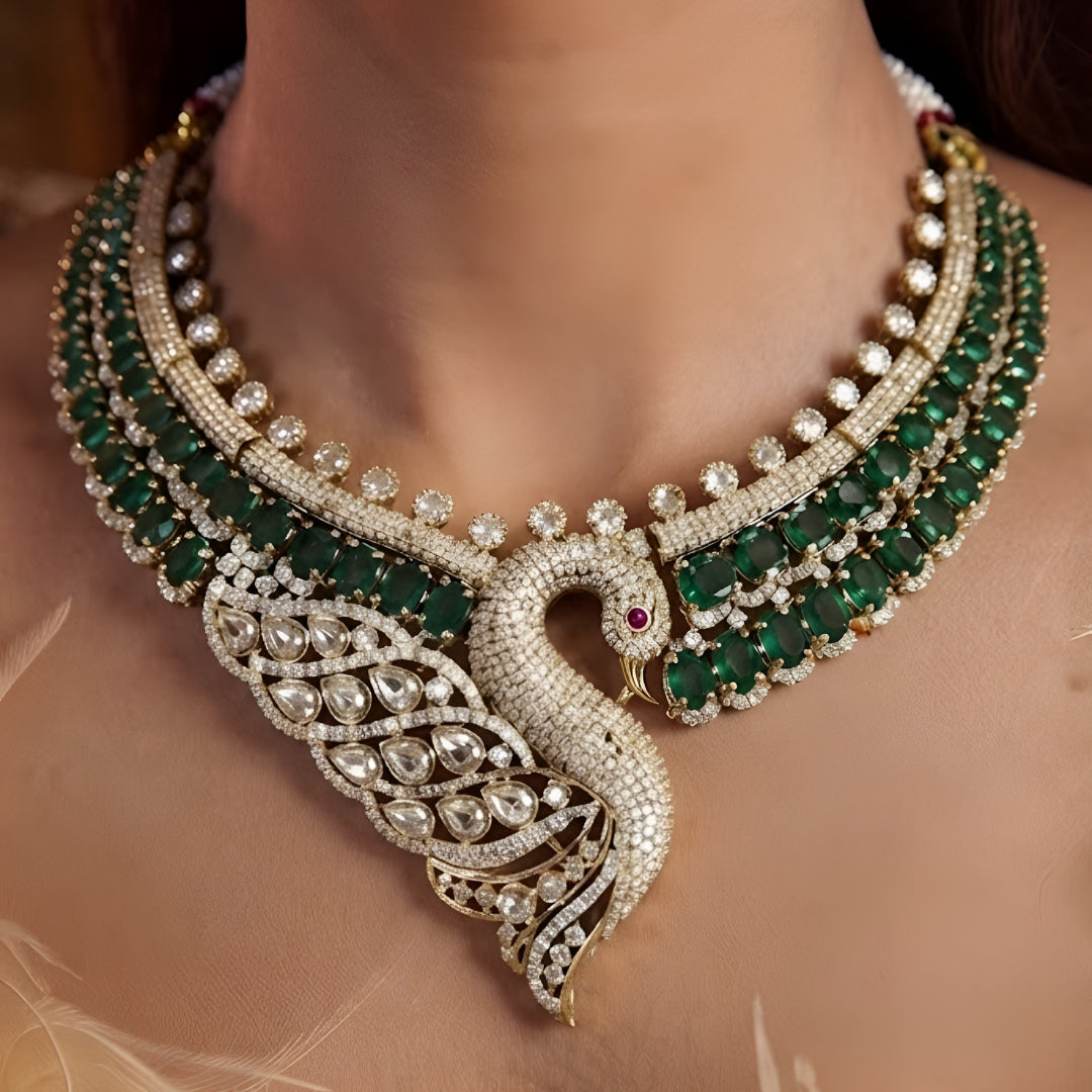 Luxury green swan designer necklace set with American diamonds, emerald green stones, and matching swan earrings for bridal wedding and party wear.