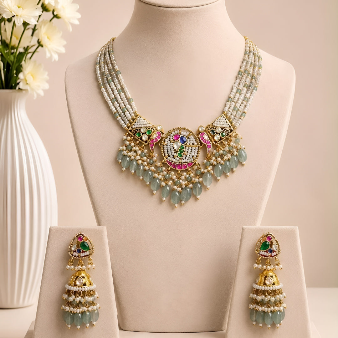 "Kundan medallion necklace set with sage green bead drops and matching jhumka earrings"