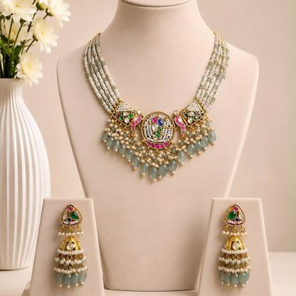 "Kundan medallion necklace set with sage green bead drops and matching jhumka earrings"