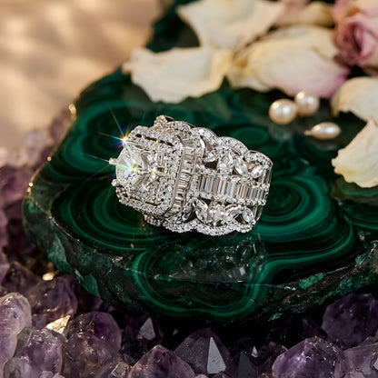 Luxury silver-tone cubic zirconia statement ring with princess-cut center stone and baguette crystal accents