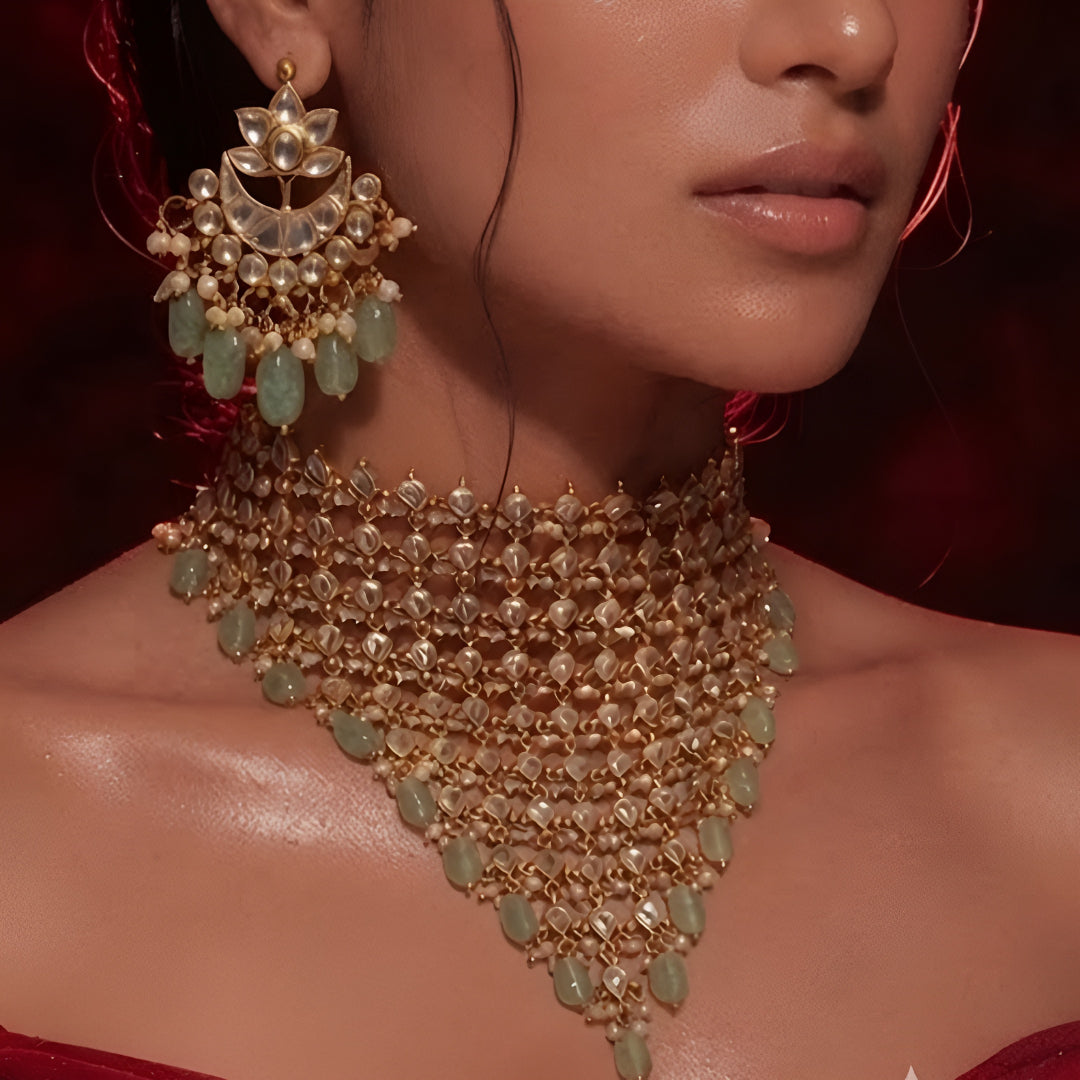 "Woman wearing gold Kundan choker necklace set with green beaded drops and matching chandbali earrings, bridal jewellery"