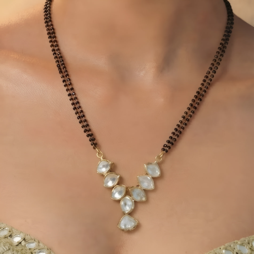 Elegant pear stone black beads mangalsutra necklace set with matching stud earrings in gold-tone finish for women