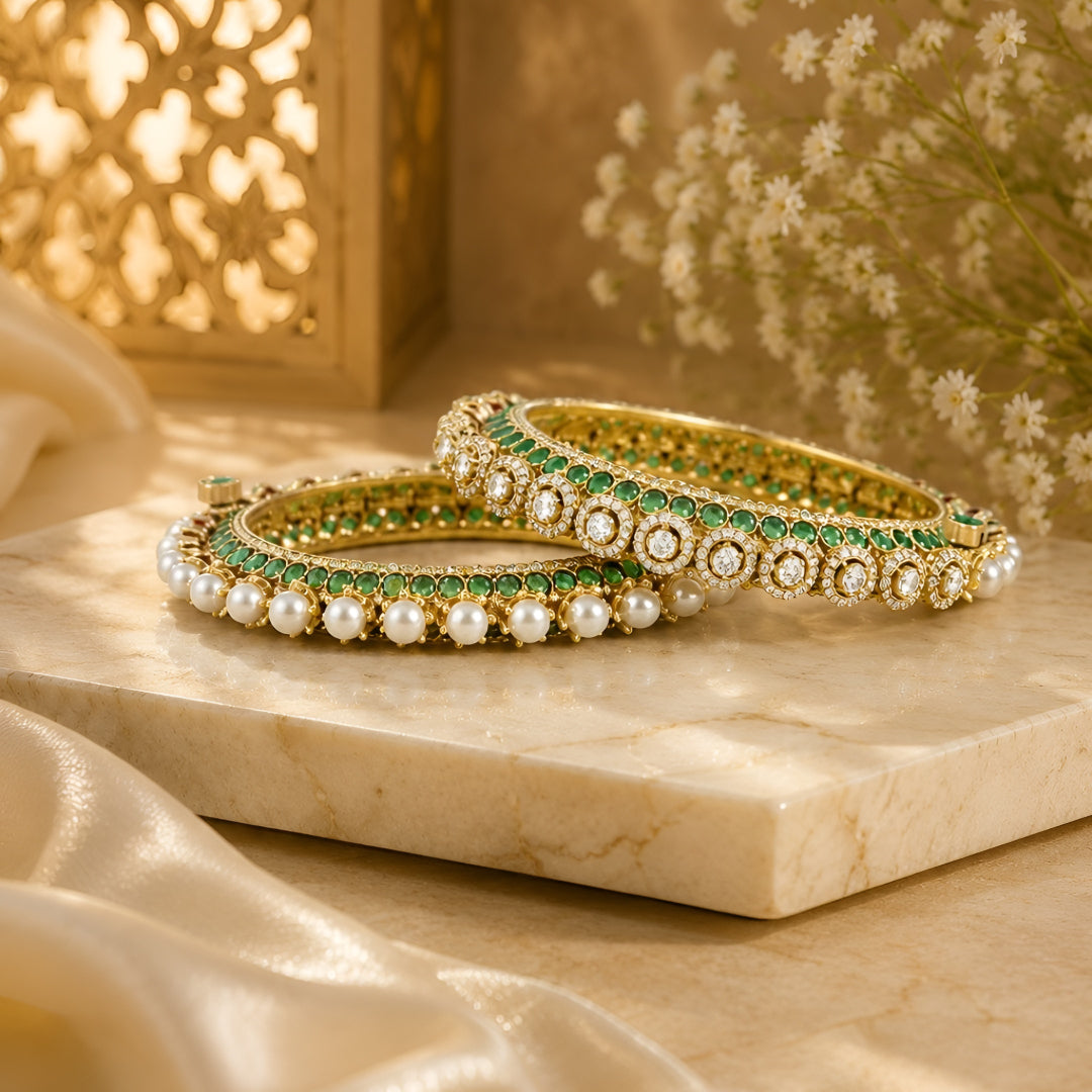 Gold-plated green Kundan bangles with pearl border and sparkling white stones for women.