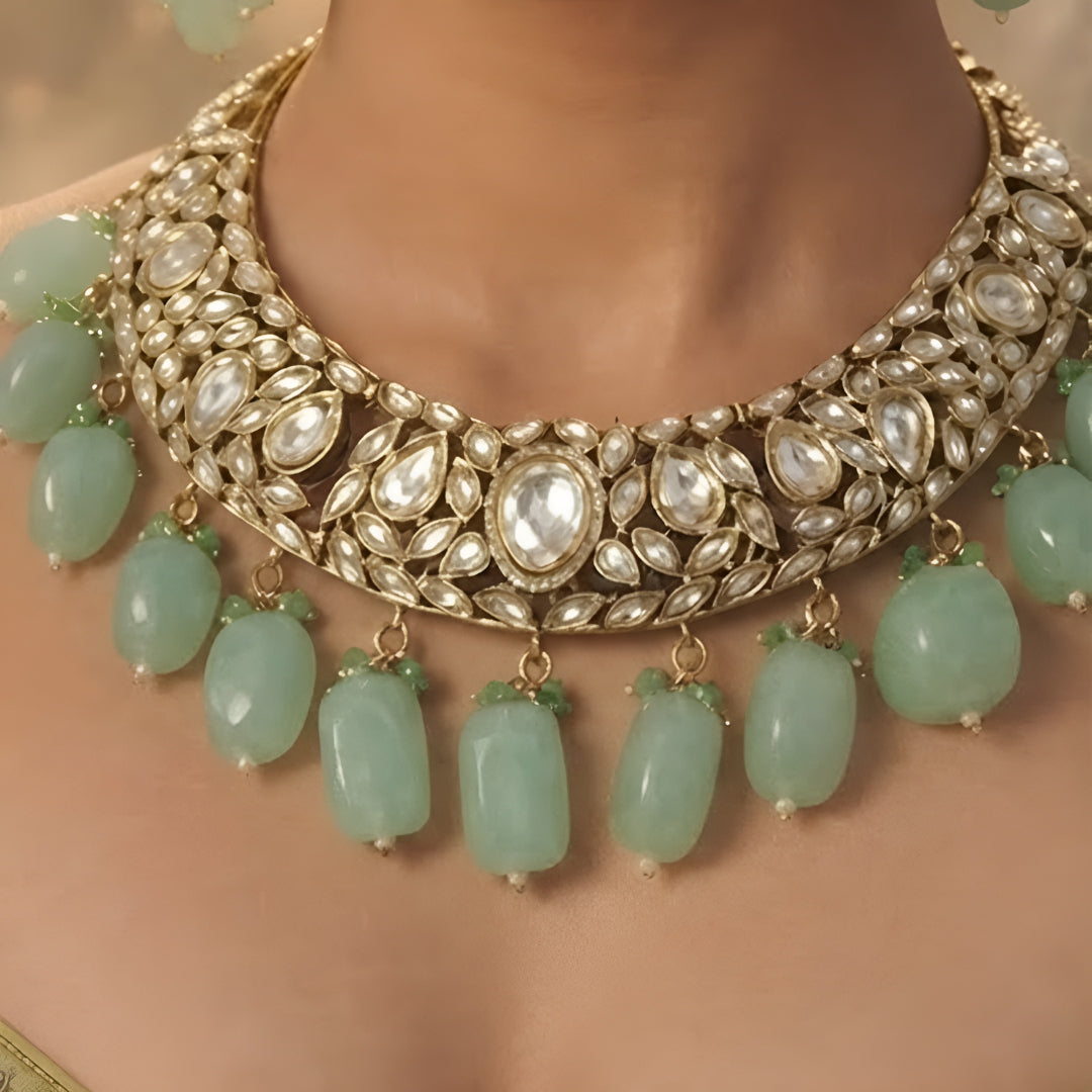 Green Kundan Polki choker necklace set with mint green bead drops and matching statement earrings for bridal, wedding, and traditional ethnic wear.