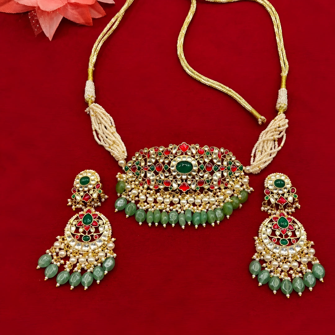 "Antique gold choker with ruby emerald stone work and matching earrings"