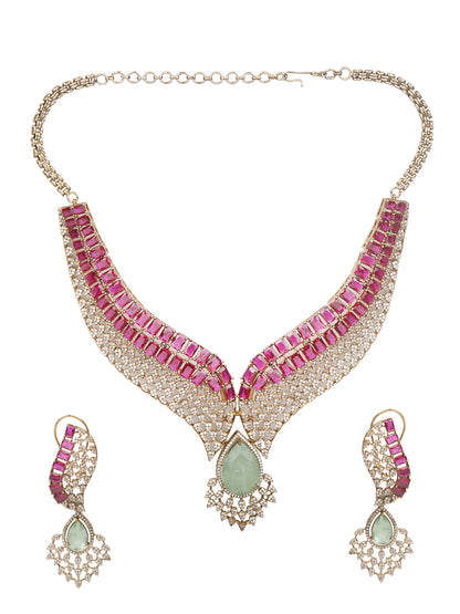 Gold plated ruby and emerald statement necklace set with matching earrings, bridal jewelry design with teardrop green stone and crystal detailing
