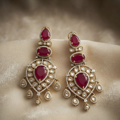 Ruby red stone and Polki gold plated chandelier earrings for women, bridal wedding statement ethnic jewelry with dangling drops.