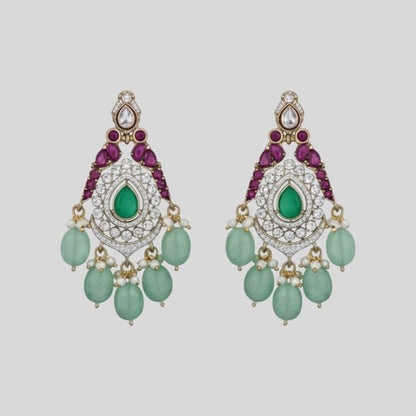 "Triple-layer gold-finish necklace set with green stones, purple detailing, American Diamond accents, pastel green bead drops, and matching earrings displayed on a light background."