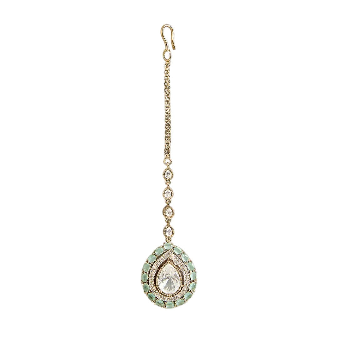 Gold-plated mint green Kundan maang tikka with teardrop American Diamond pendant for bridal, wedding, festive, and ethnic wear.