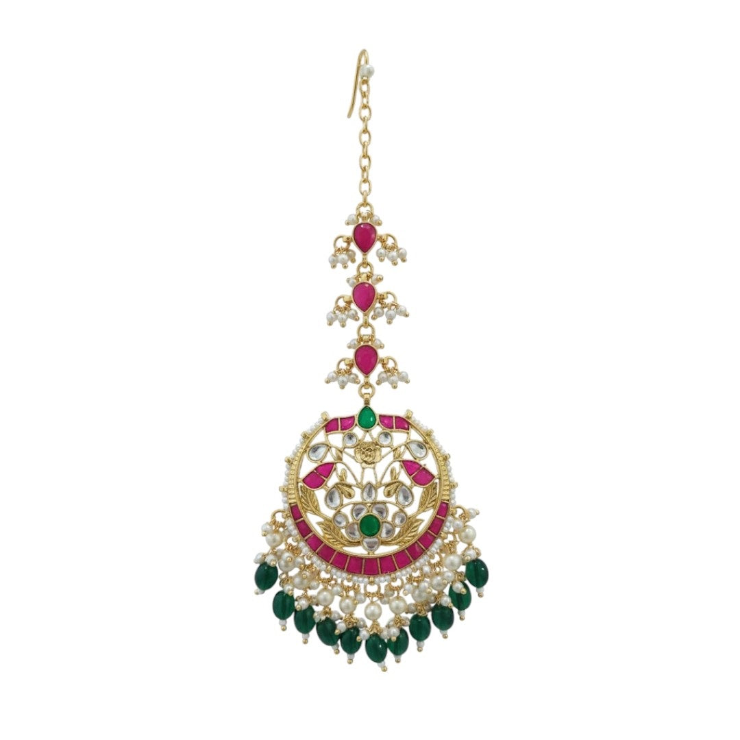Traditional gold-plated Kundan maang tikka with ruby, emerald, and pearl detailing – bridal headpiece for women