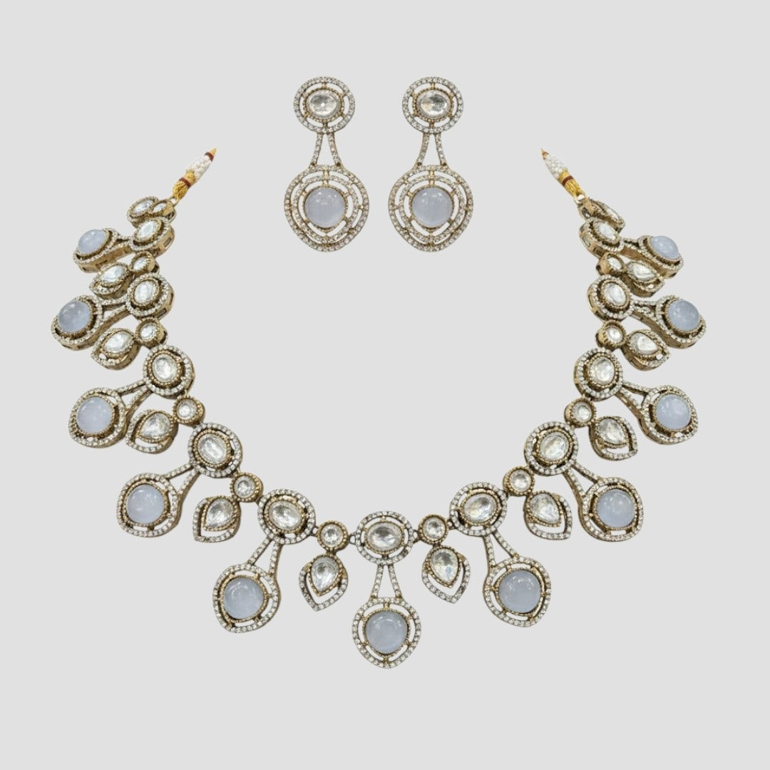 “Gold-plated white stone kundan necklace set with matching earrings for women, bridal and festive wear.”