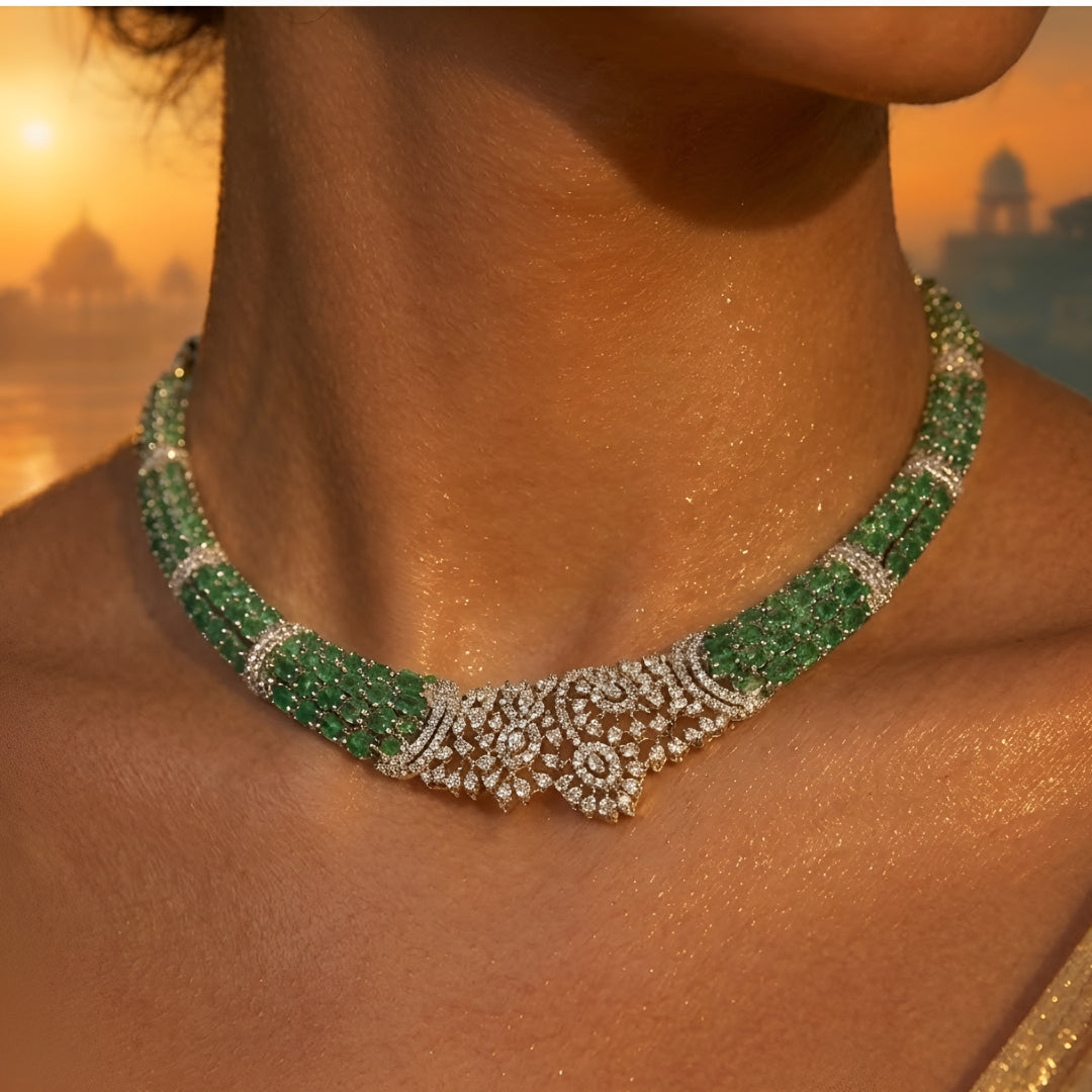 Silver-toned emerald green crystal choker necklace set featuring sparkling stone detailing and matching statement drop earrings on a white background.