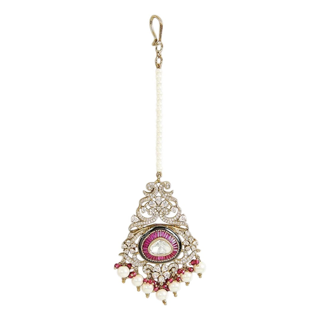 Traditional gold-plated Kundan maang tikka with pink teardrop stone, white pearl drops and beaded chain for bridal and festive wear.