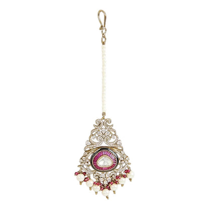 Traditional gold-plated Kundan maang tikka with pink teardrop stone, white pearl drops and beaded chain for bridal and festive wear.