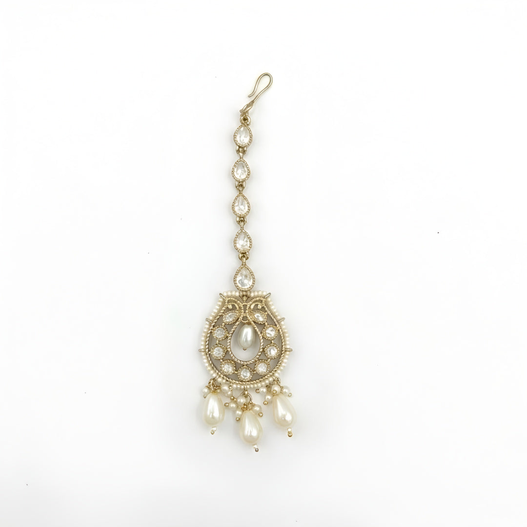 Gold plated pearl Kundan maang tikka with white stones and pearl drop danglers for bridal, wedding, and festive wear.